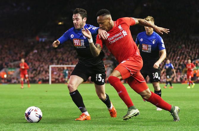 Liverpool's Nathaniel Clyne (righ) takes on Bournemouth's Adam Smith as they vie for possession during their League Cup match at Anfield