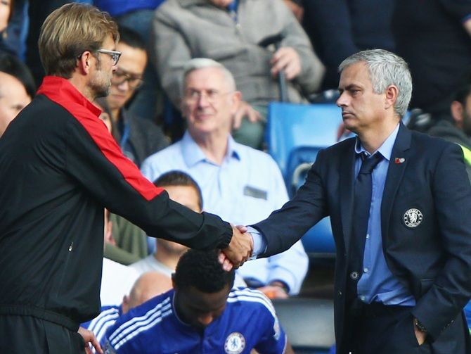 Jurgen Klopp, manager of Liverpool and Jose Mourinho, manager of Chelsea shake hands