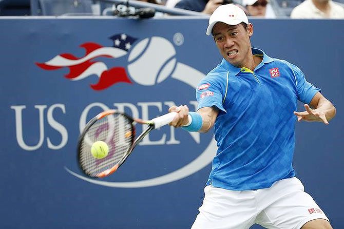 Japan's Kei Nishikori returns a shot to France's Benoit Paire (not pictured) during their opening round match at the US Open on Monday