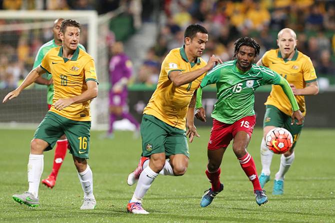 Tim Cahill of Australia and MD Linkon of Bangladesh battle for posession