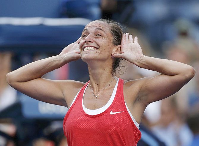 Roberta Vinci celebrates with the crowd after defeating Serena Williams
