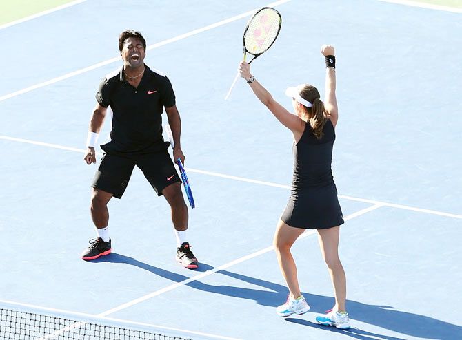 Switzerland's Martina Hingis and India's Leander Paes celebrate after defeating USA's Bethanie Mattek-Sands and Sam Querrey to win the US Open mixed doubles title on Friday