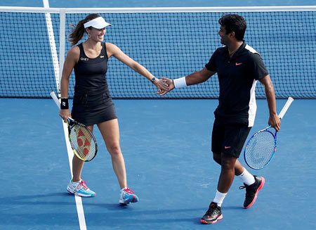 Martina Hingis and Leander Paes celebrate a point
