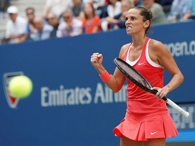 Roberta Vinci celebrates a point against Serena Williams