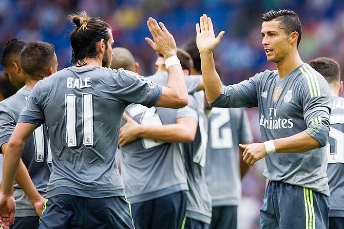 Real Madrid's Cristiano Ronaldo (right) is congratulated by his teammate Gareth Bale after scoring his team's sixth goal during the La Liga match against Espanyol at Cornella-El Prat Stadium in Barcelona on Sunday