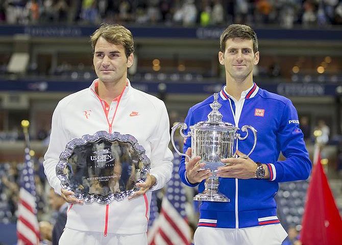 Novak Djokovic and Roger Federer at the trophy presentation after their US Open men's singles final on Sunday