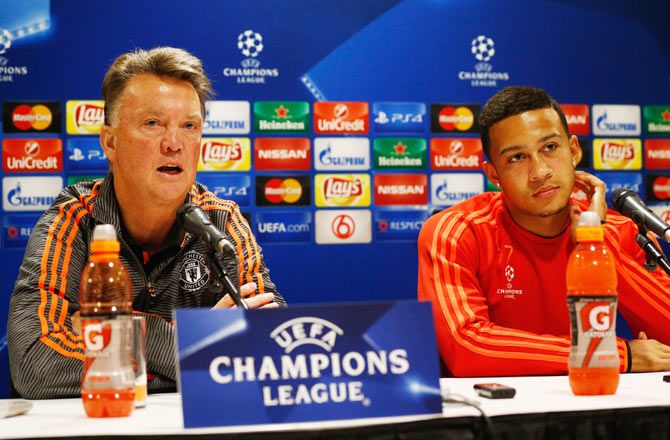 Manchester United head coach-manager, Louis van Gaal and forward Memphis Depay speak to the media during a press conference at the Philips Stadion in Eindhoven, Netherlands, on Monday