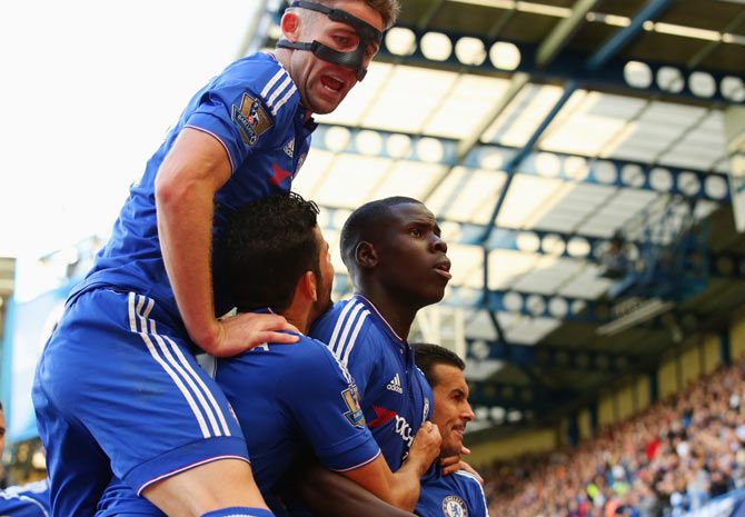 Kurt Zouma of Chelsea celebrates scoring his team's first goal with his team mates during the Barclays Premier League match between Chelsea and Arsenal