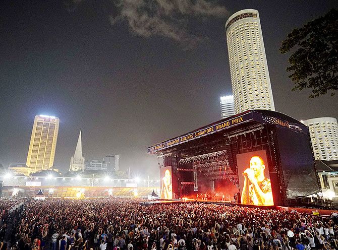 A big screen shows Adam Levine in concert at the Marina Bay street circuit in Singapore on Saturday