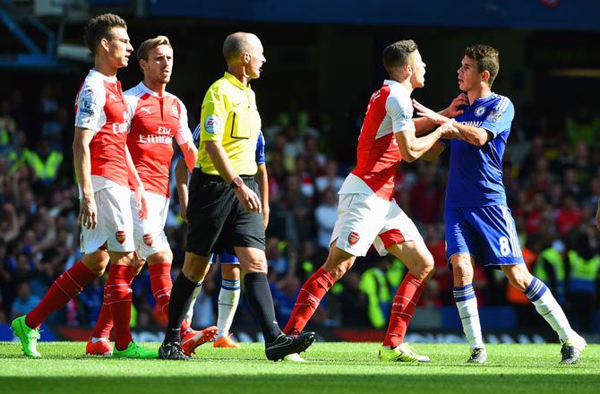 Arsenal's Gabriel gets into a scuffle with Chelsea's Diego Costa l during the English Premier League match at Stamford Bridge in London on Saturday, September 19