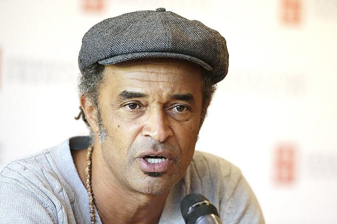Singer and former professional tennis player Yannick Noah, newly-named French Davis Cup team captain, talks to journalists during a news conference at the Roland Garros stadium in Paris on Tuesday