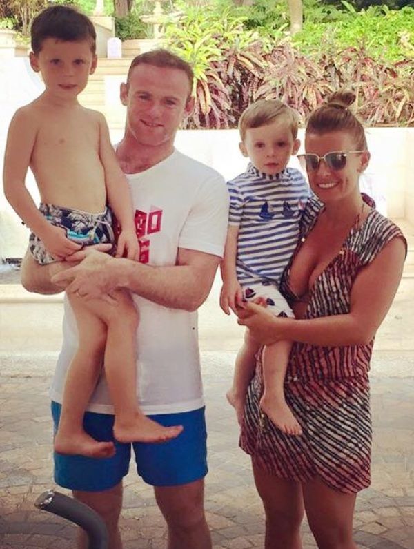 Wayne Rooney with his wife and kids