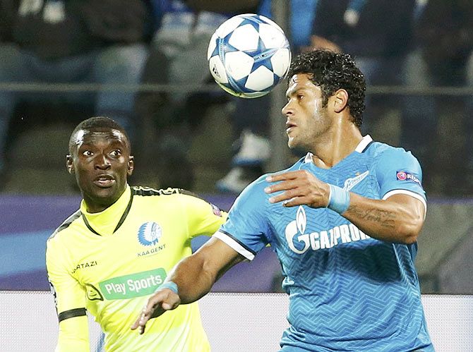 Zenit St. Petersburg's Hulk (right) fights for an aerial ball with KAA Gent's Nana Asare during their Champions League group H match at the Petrovsky stadium in St. Petersburg, on Tuesday