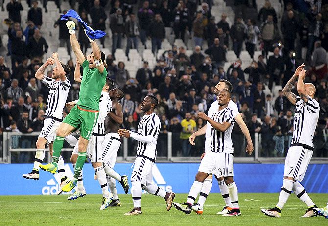 Juventus' players celebrate at the end of the match against Empoli on Saturday