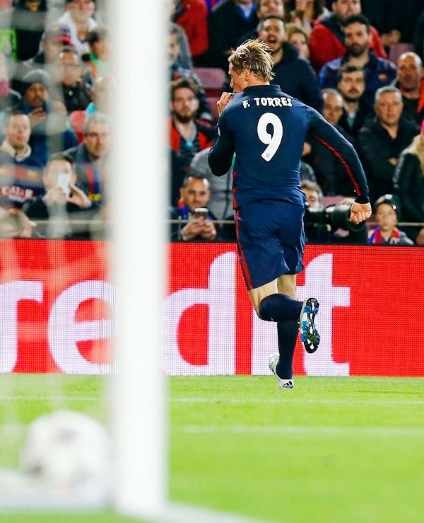 Atletico Madrid's Fernando Torres celebrates after scoring the opening goal