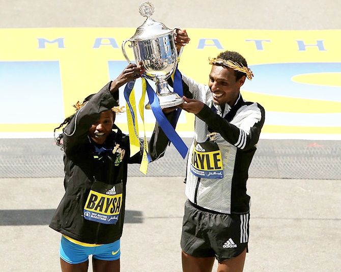 Women's winner Atsede Baysa of Ethiopa and men's winner Lemi Berhanu Hayle of Ethiopia