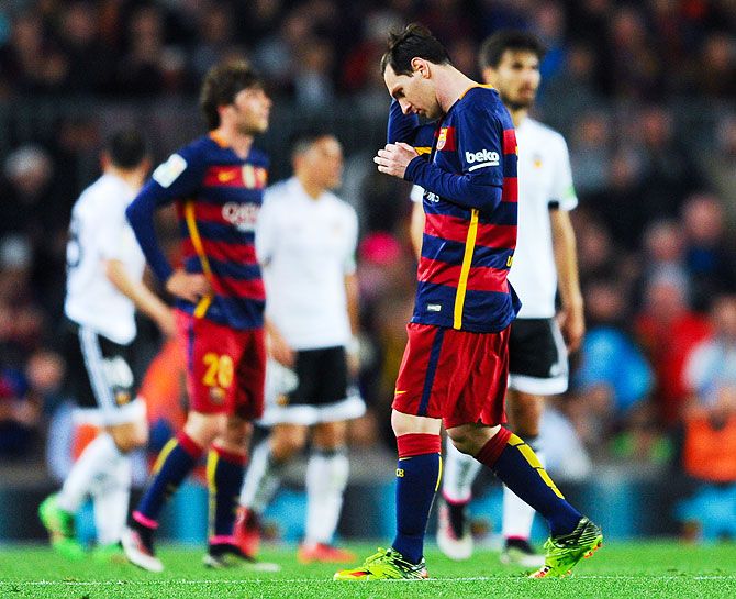 FC Barcelona's Lionel Messi is dejected after Valencia CF's Santi Mina scored his team's second goal during their La Liga match at Camp Nou in Barcelona on Sunday