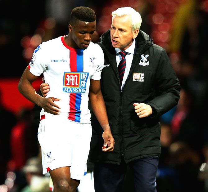 Crystal Palace's Wilfried Zaha and manager Alan Pardew in conversation