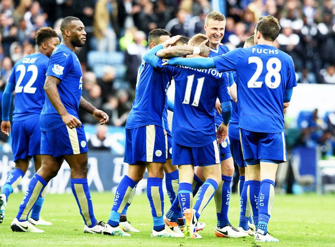 Marc Albrighton of Leicester City celebrates with teammates