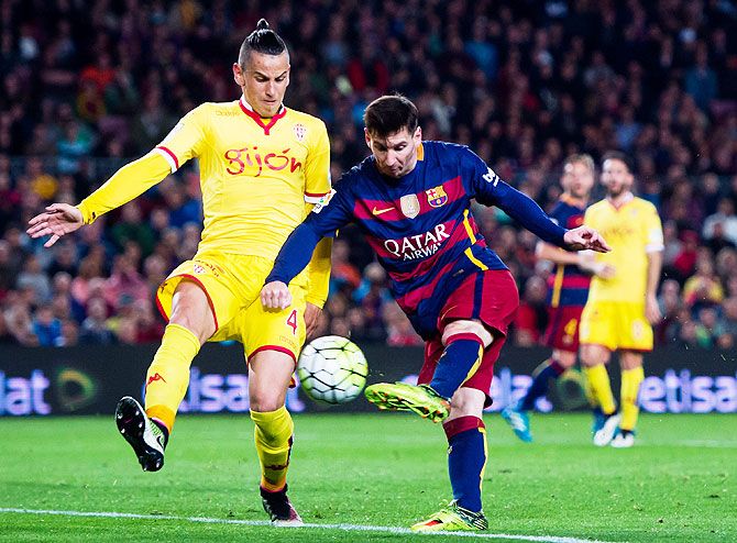 Barcelona's Lionel Messi shoots to score