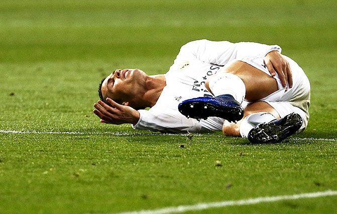 Real Madrid's Cristiano Ronaldo reacts after injuring his hamstring during the La Liga match against Villareal at the Santiago Bernabeu in Madrid on Wednesday, April 20 