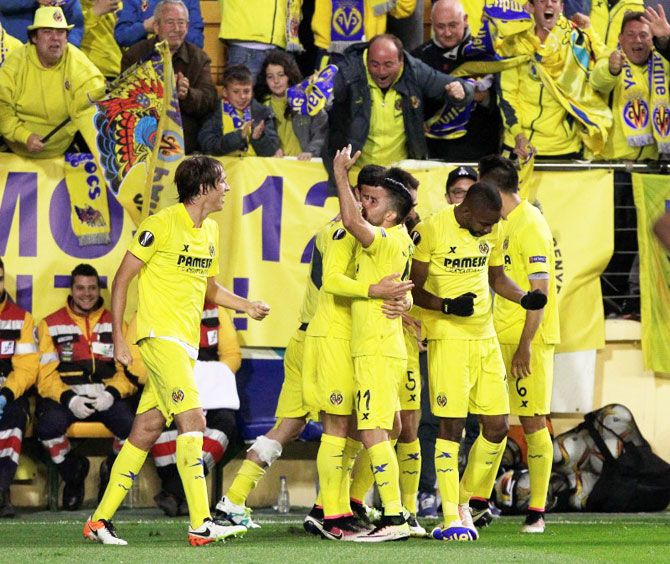 Villarreal's Adrian celebrates with teammates on scoring the late winner against Liverpool during their UEFA Europa League, semi-final, first leg match at the El Madrigal Stadium, in Villarreal on Friday