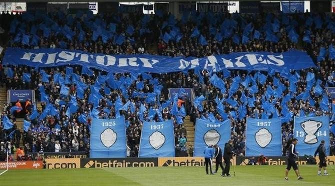 Leicester fans hold up banners during Leicester City’s Barclays Premier League  match against Swansea City at the King Power Stadium