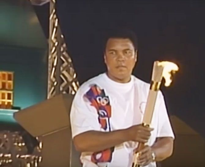 Boxing legend Muhammad Ali lights the Olympic flame at the Centinial Games at the Atlanta Olympics