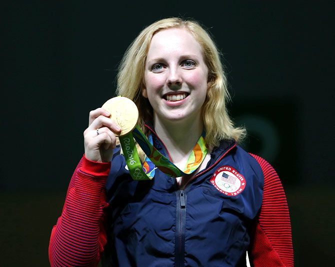 Virginia Thrasher of United States poses with the gold medal which she won in the women's 10m Air Rifle event at the 2016 Olympic Games, in Rio de Janeiro