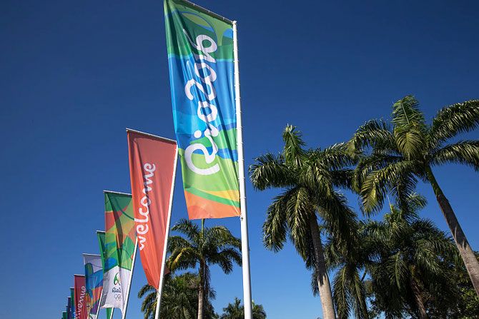 Flags with the logo of Rio 2016 Olympic and Paralympic Games among others reading 'Welcome' in different languages are view near Antonio Carlos Jobim (Galeão) International Airport in Rio de Janeiro, Brazil