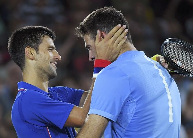 Djokovic with Juan Martin Del Potro after their Olympic first round match. The Argentinian shocked the Serb 7-6. 7-6.Photograph: Toby Melville/Reuters