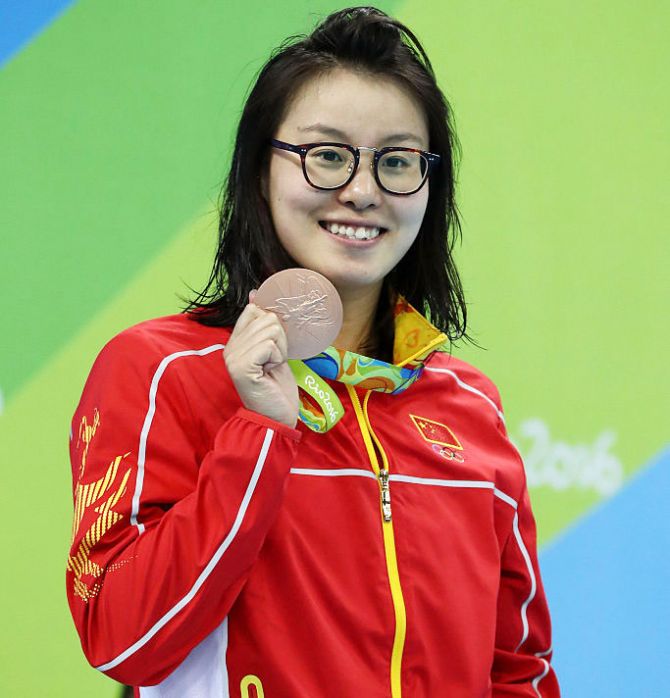 Bronze medalist Yuanhui Fu of China on the podium during the medal ceremony for the Women's 100m backstroke final on Monday