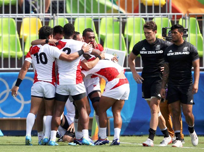 Japan celebrates after defeating New Zealand in their Pool C preliminary Rugby 7s match at the Rio Olympics in Deodoro Stadium in Rio de Janeiro on Tuesday
