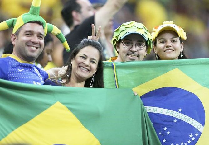 Fans reacts from the stands prior to a men's soccer match between hosts Brazil and Iraq