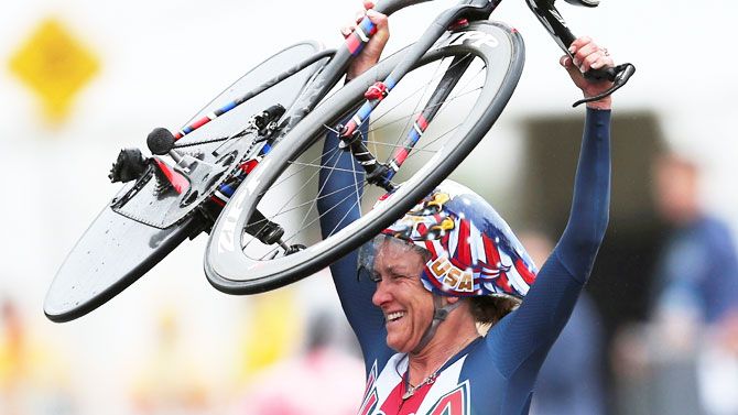 Kristin Armstrong celebrates after winning the Cycling Road Women's Individual Time Trial on August 10