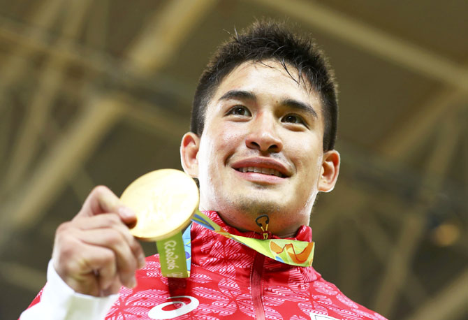 Japan's Mashu Baker poses with his medal after winning the Men's 90kg Judo final on Wednesday