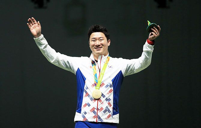 Gold medalist Jin Jong-oh of Korea poses on the podium following the 50m piistol event on Day 5 of the Rio 2016 Olympic Games at the Olympic Shooting Centre on Wednesday