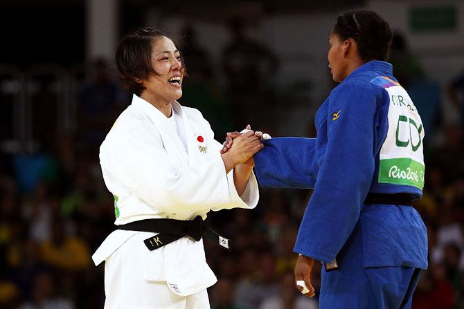 Haruka Tachimoto of Japan shakes hands after defeating Yuri Alvear of Colombia during the Women's -70kg Gold Medal bout on Wednesday