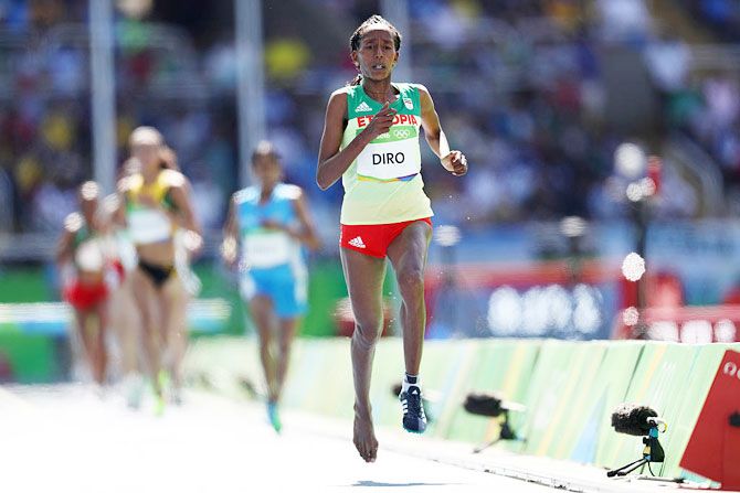 Etenesh Diro of Ethiopia competes with a missing a running shoe in the Women's 3000m Steeplechase Round 1 heats on Day 8 of the Rio 2016 Olympic Games at the Olympic Stadium in Rio de Janeiro on Saturday