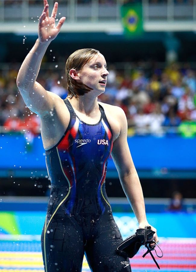 Katie Ledecky of the United States celebrates winning gold and setting a new world record on Day 7