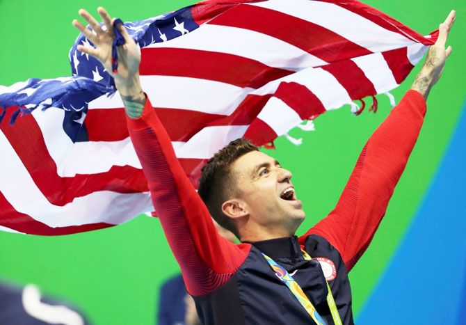 Anthony Ervin of USA celebrates his gold medal win in the Men's 50m Freestyle swimming event at the Olympic Aquatics Stadium on Friday