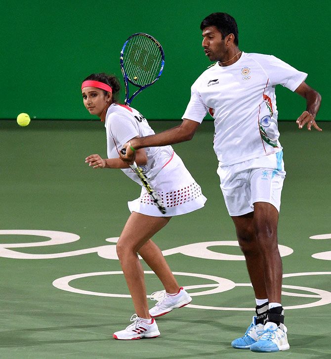 India's Sania Mirza, (left) and Rohan Bopanna in action in their mixed doubles semi-final at the 2016 Rio Olympic Games