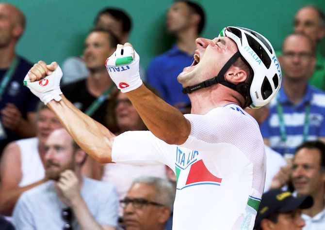 Elia Viviani of Italy reacts after winning gold in the Men's Omnium 40km Points Cycling Race on Monday