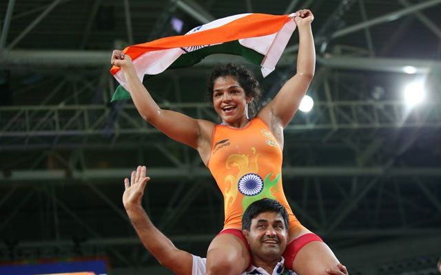 India’s Sakshi Malik celebrates with a team member after defeating Aisuluu Tynybekova of Kyrgyzstan in the 58kg freestyle bronze medal play-off at the Rio Olympics