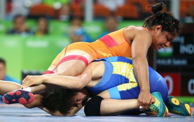 India's Sakshi Malik pins down Aisuluu Tynybekova of Kyrgyzstan in the 58kg freestyle bronze medal play-off at the Rio Olympics.
