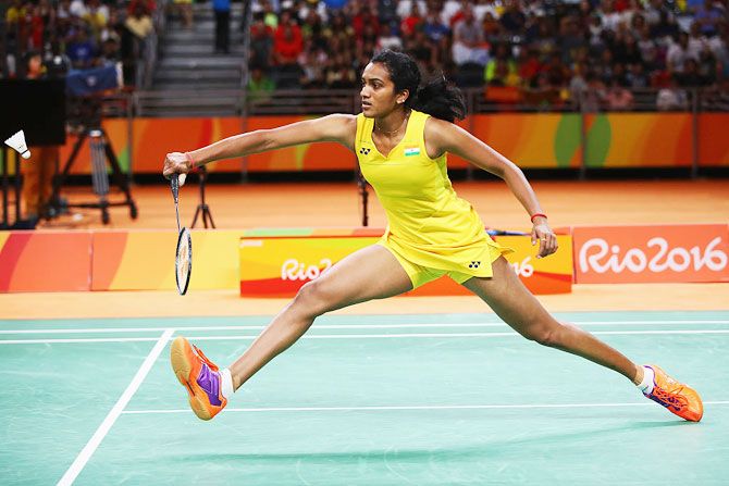 PV Sindhu of India plays a return against Carolina Marin of Spain during the Rio Olympic badminton final on Friday