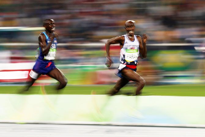 Mo Farah of Great Britain and Paul Kipkemoi Chelimo of the United States compete during the Men's 5000m final on August 20