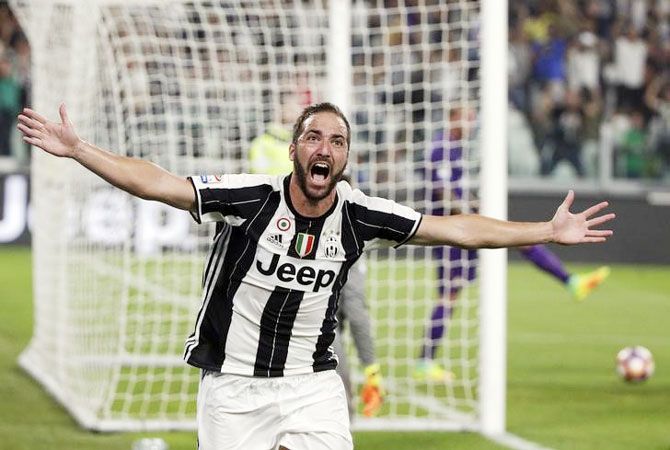 Juventus' Gonzalo Higuain celebrates after scoring against Fiorentina on Saturday