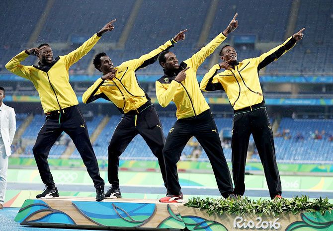 Silver medalists Peter Matthews, Javon Francis, Naton Allen and Fitzroy Dunkley of Jamaica stand on the podium during the medal ceremony for the Men's 4 x 400 meter Relay