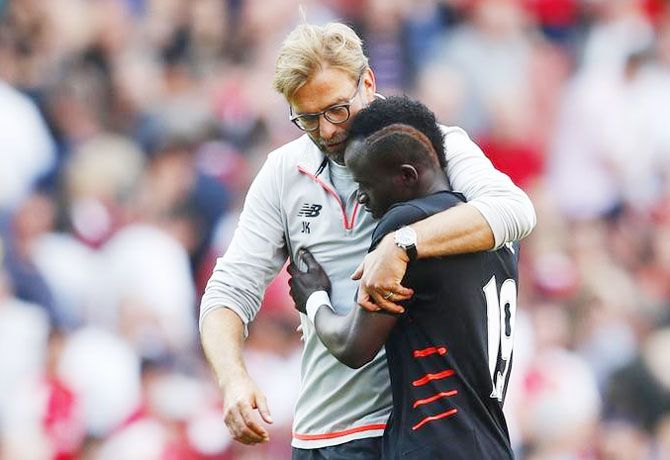 Liverpool manager Juergen Klopp celebrates with Sadio Mane after the match